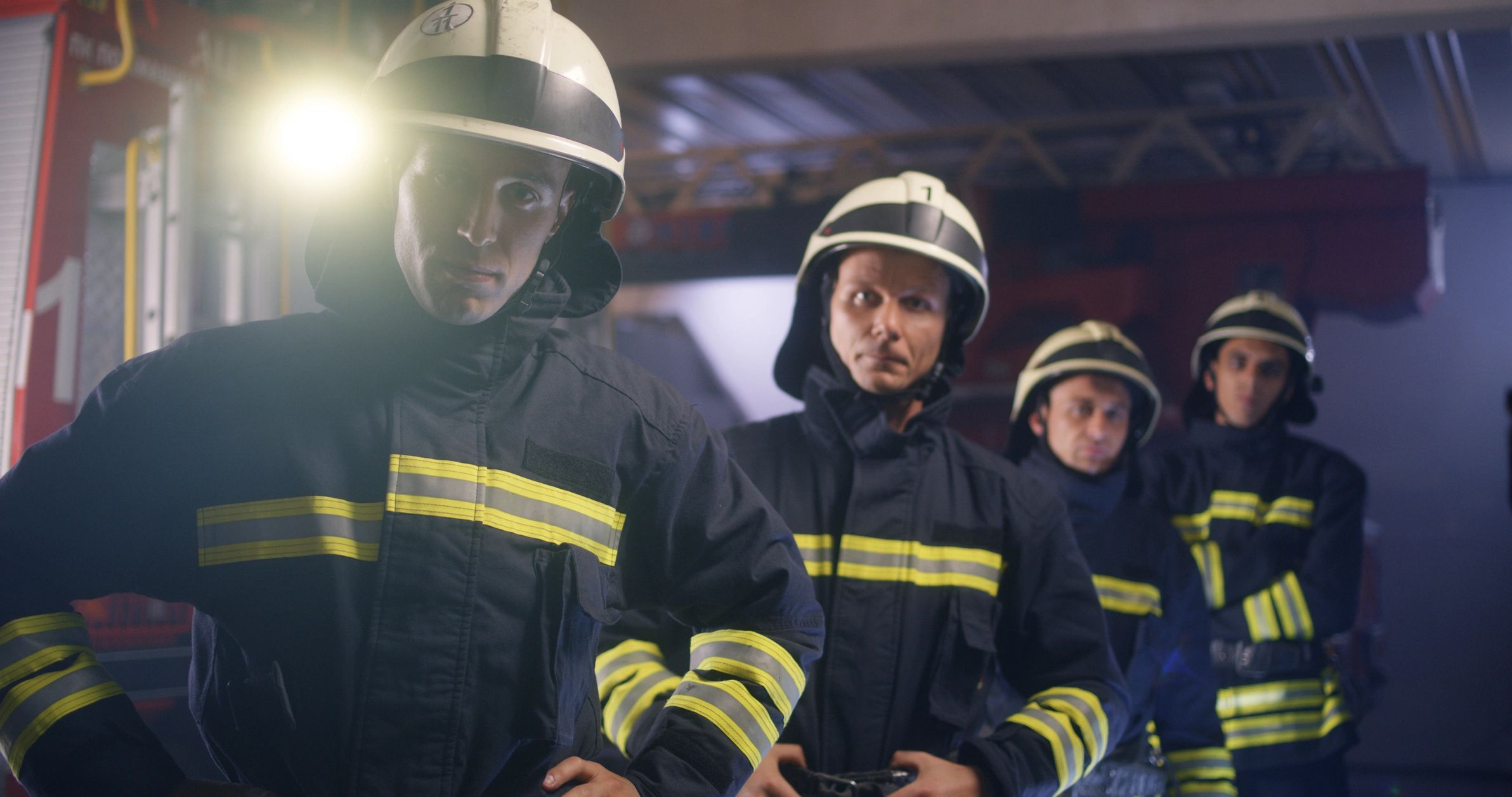 Firefighter team in helmets representing academy leadership