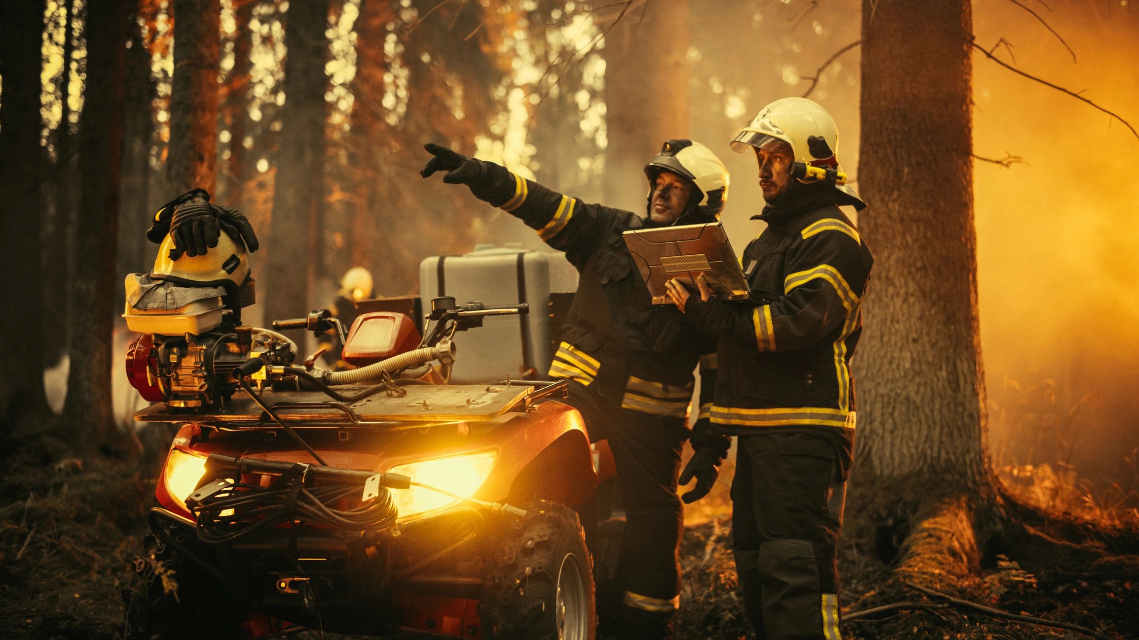 Professional firefighters reviewing strategy during field training